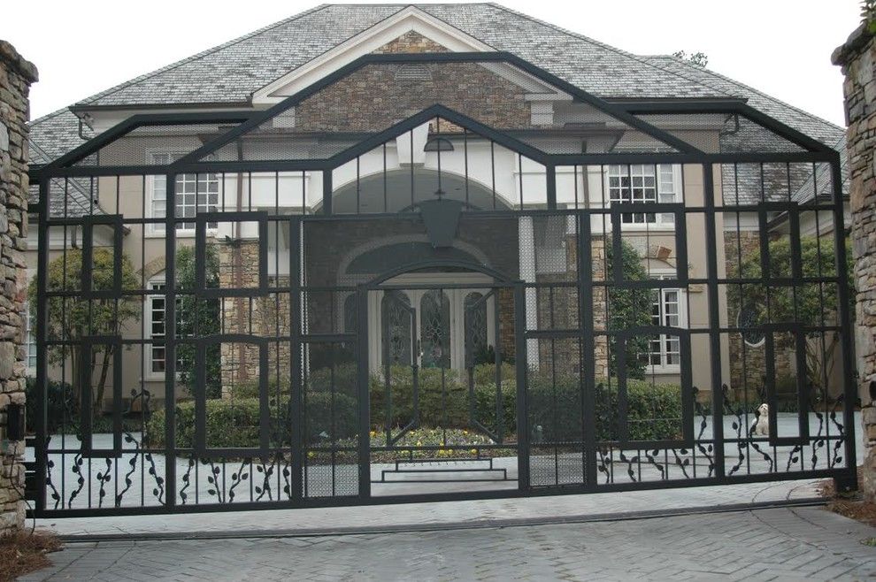 Allied Fence for a Traditional Exterior with a Black Wrought Iron Gate and Estate Gates by Allied Fence Co