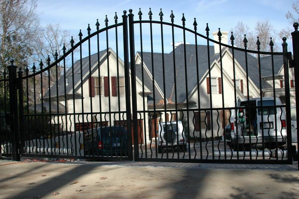 Allied Fence for a Traditional Exterior with a Wrought Iron Arched Gate and Estate Gates by Allied Fence Co