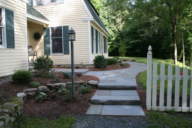 Allied Fence for a Transitional Landscape with a Yellow House and Frontyard Projects by Perennial Landscaping