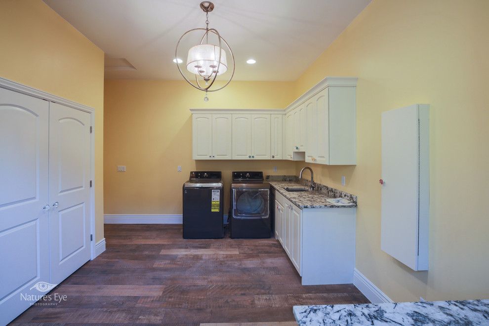 American Heritage Billiards for a Transitional Spaces with a Farmhouse Sink and Foremaster Ridge by American Heritage Homes