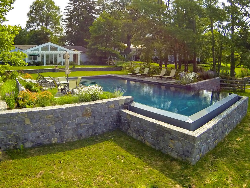Aquatech for a Traditional Pool with a Slate Tile and Infinity Edge Elements   New Castle, De by Armond Aquatech Pools