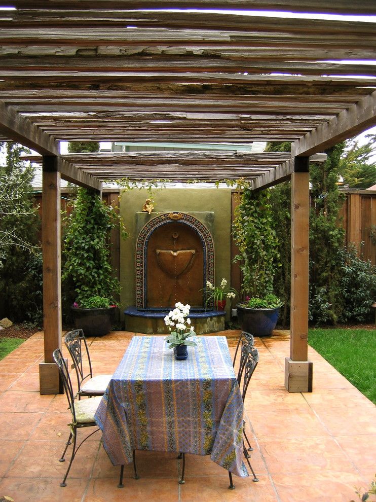Arbors on Post Oak for a Mediterranean Patio with a Fountain and Santa Cruz I by Kathleen Shaeffer Design, Exterior Spaces
