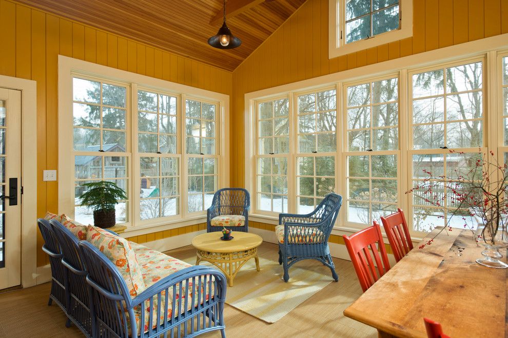 Artistica Furniture for a Farmhouse Sunroom with a Floral Outdoor Cushions and Leed Platinum Home by Phinney Design Group