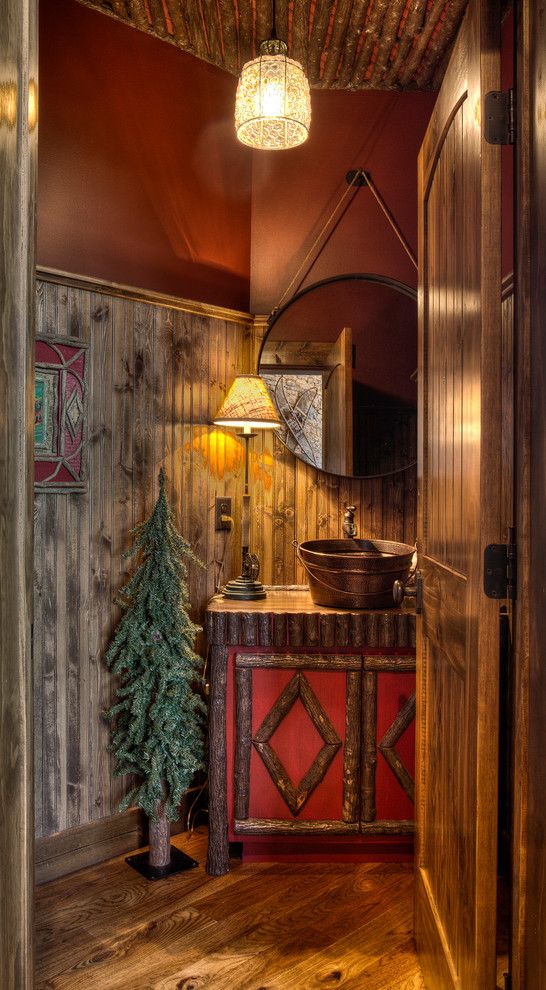 Atlas Flooring for a Rustic Powder Room with a Copper Bucket Sink and Pig Bay by Lands End Development   Designers & Builders