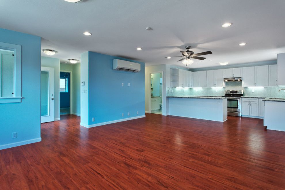 Atlas Flooring for a Transitional Family Room with a Dark Wood Floors and Kuroda by Atlas Construction