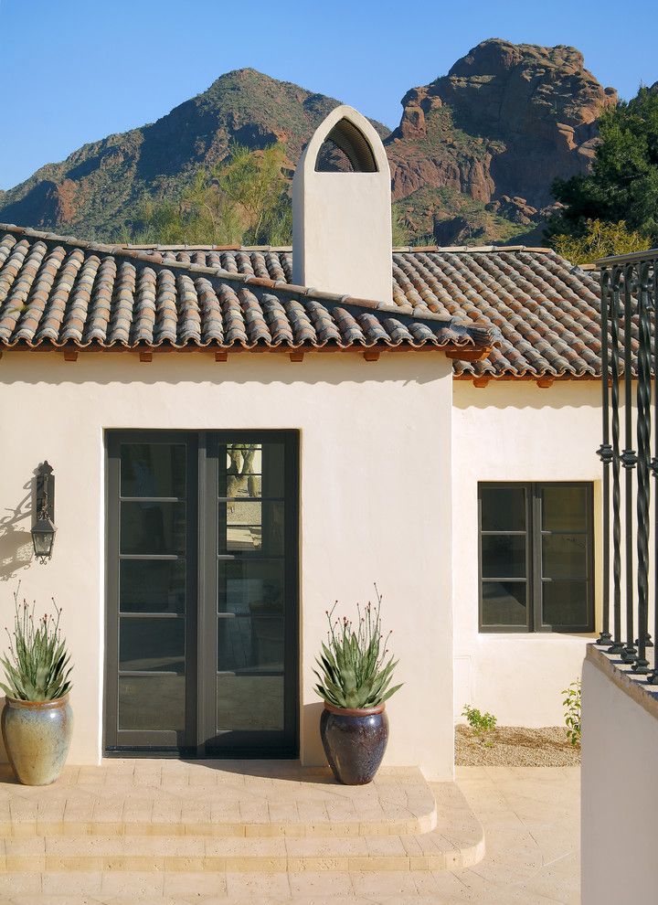 Atrium Windows and Doors for a Mediterranean Entry with a Outdoor Lighting and Carson Poetzl, Inc. by Carson Poetzl, Inc.