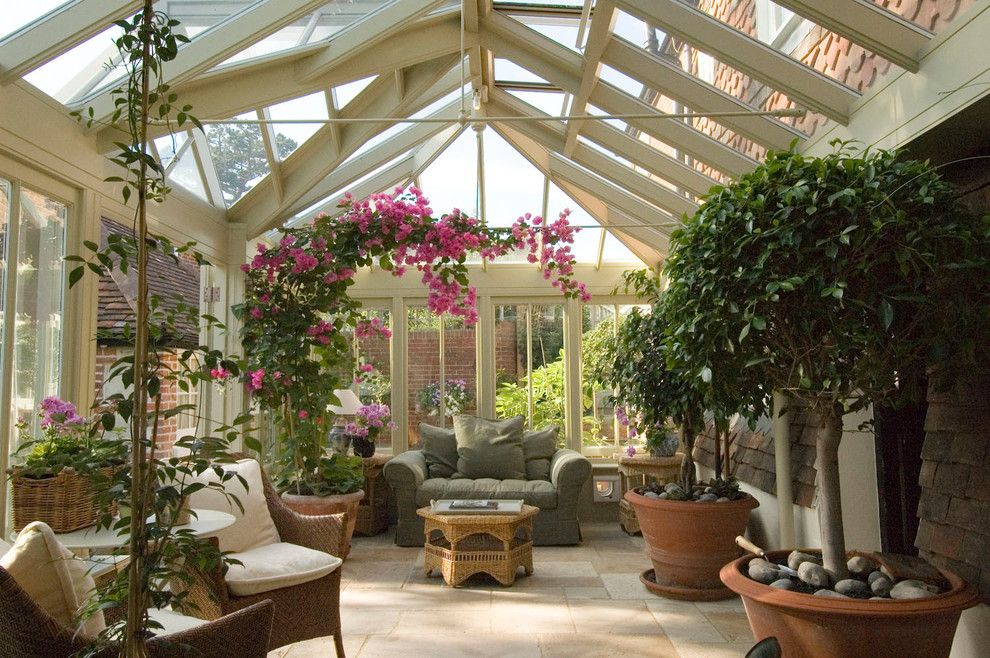 Avalon West Chelsea for a Traditional Sunroom with a Stone Floor and a Conservatory for Plants and People by Town and Country Conservatories