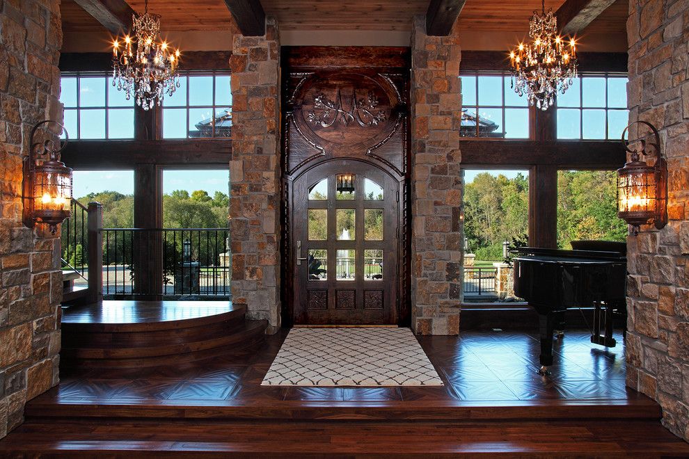 Baby Grand Piano Dimensions for a Rustic Entry with a Crystal Chandelier and Old World Deer Lodge Estate by James Mcneal Architecture and Design