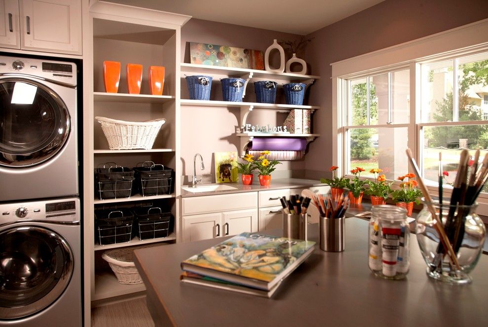 Bagcraft Papercon for a Traditional Laundry Room with a Stacked Washer and Dryer and Model Home by Vanbrouck & Associates, Inc.