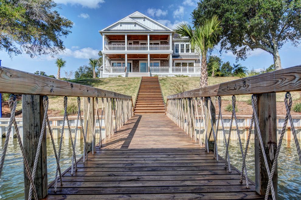 Bald Eagle Wingspan for a Beach Style Exterior with a Pal Trees and Georgetown Model by Logan Homes on Bald Eagle Lane by Logan Homes