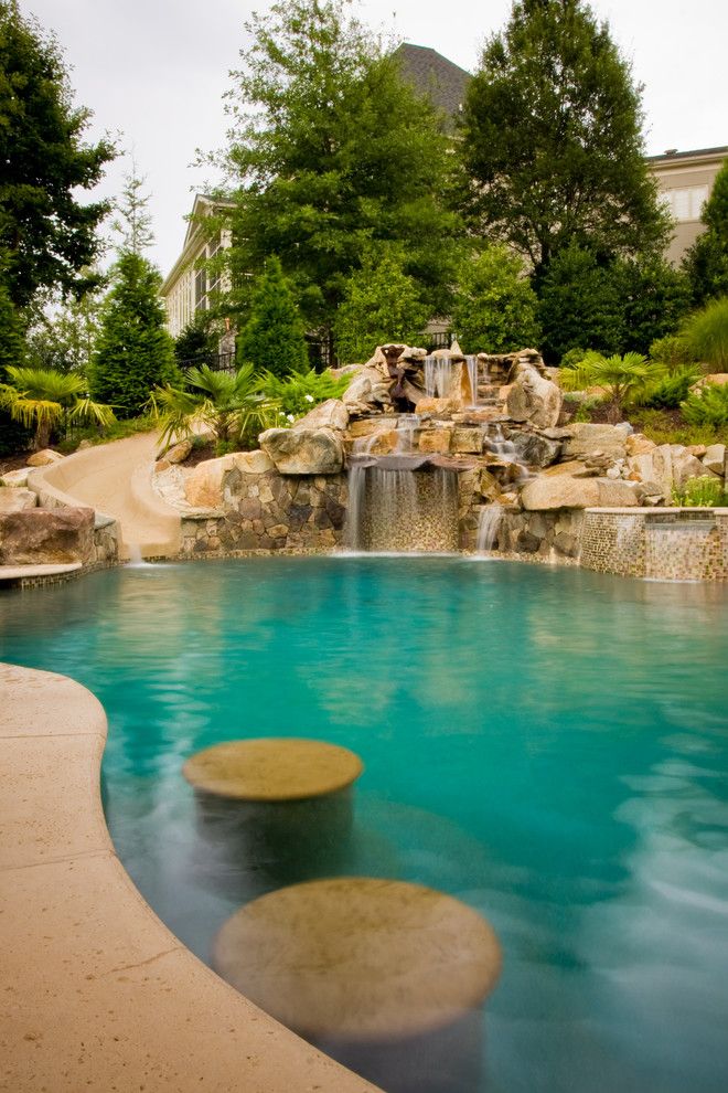 Ballantyne Spa for a Tropical Spaces with a Tanning Ledge and Ballantyne Tropical Oasis by Coogan's Landscape Design