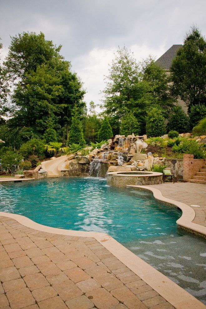 Ballantyne Spa for a Tropical Spaces with a Tropical Pool and Ballantyne Tropical Oasis by Coogan's Landscape Design