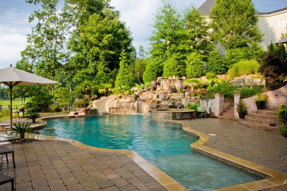 Ballantyne Spa for a Tropical Spaces with a Tropical Pool and Ballantyne Tropical Oasis by Coogan's Landscape Design