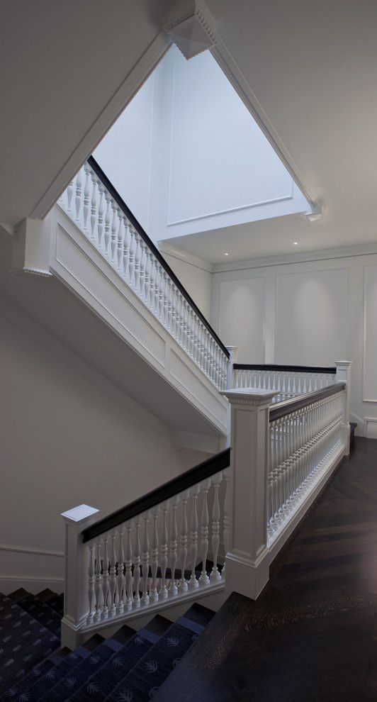 Baluster Spacing for a Traditional Staircase with a Chevron Floor and Grand Stair by Dspace Studio Ltd, Aia