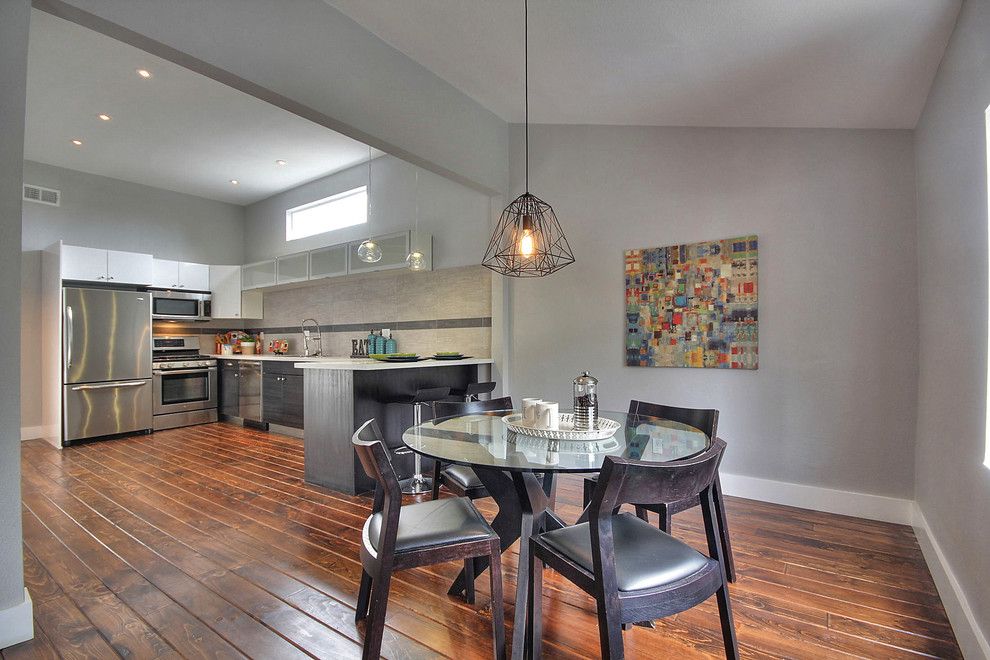 Bar Method Oakland for a Transitional Dining Room with a Round Dining Table and Modern Oakland Flip by Chic Home Interiors