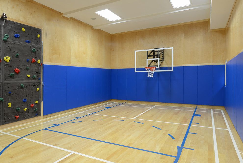 Basketball Court Layout for a Contemporary Home Gym with a Light Wood Walls and Basketball Court & Bar by Rr Builders, Llc