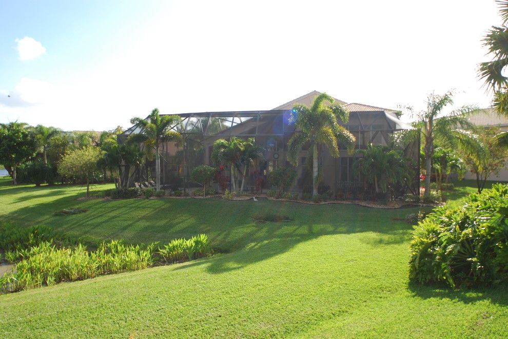 Batting Cages Miami for a Tropical Landscape with a Bird Cage and Residential Pool Enclosure by Coastal Screen and Rail