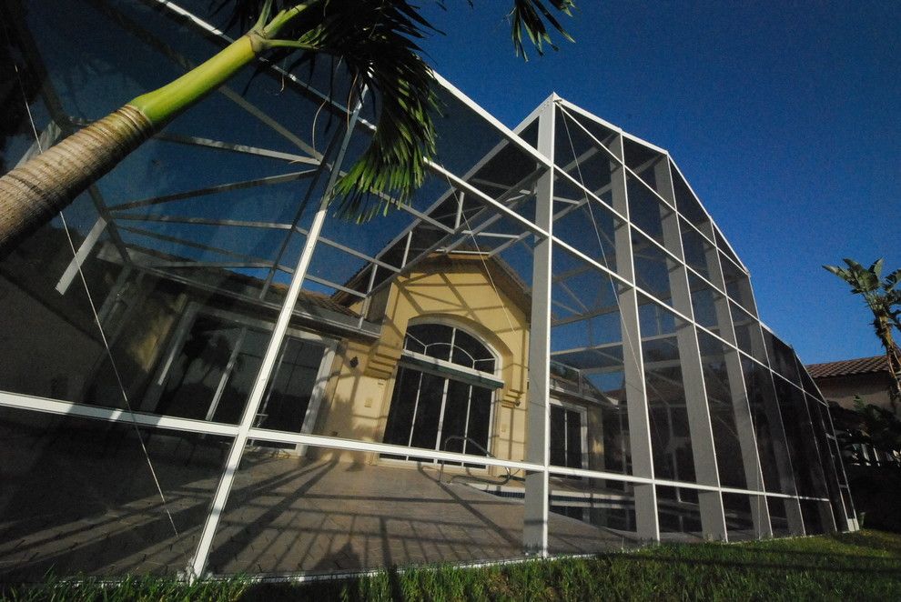 Batting Cages Miami for a Tropical Pool with a Bird Cage and Residential Pool Enclosure by Coastal Screen and Rail