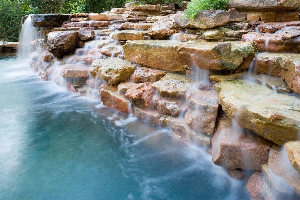 Beazer Homes Houston for a Eclectic Pool with a Blue Plaster and Natural Waterfall & Swimming Pool by Exterior Worlds Landscaping & Design