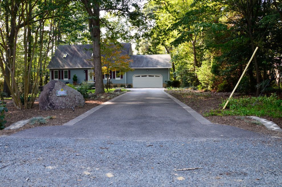 Belgard Hardscapes for a Traditional Landscape with a Driveway Border and California Front Hardscapes by the Sharper Cut, Inc. Landscapes