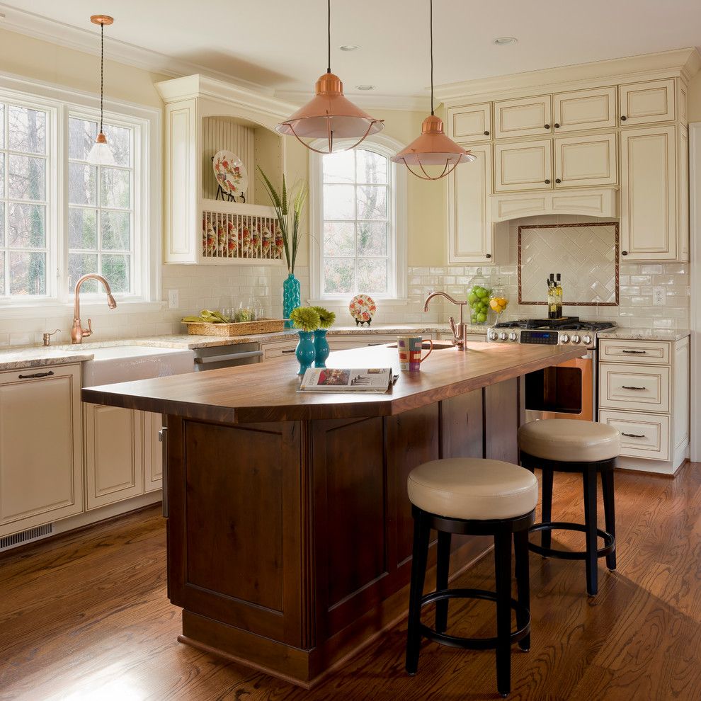 Benjamin Moore Whites for a Traditional Kitchen with a Wood Island Countertop and Williamsburg by Phoenix Builders, Inc.