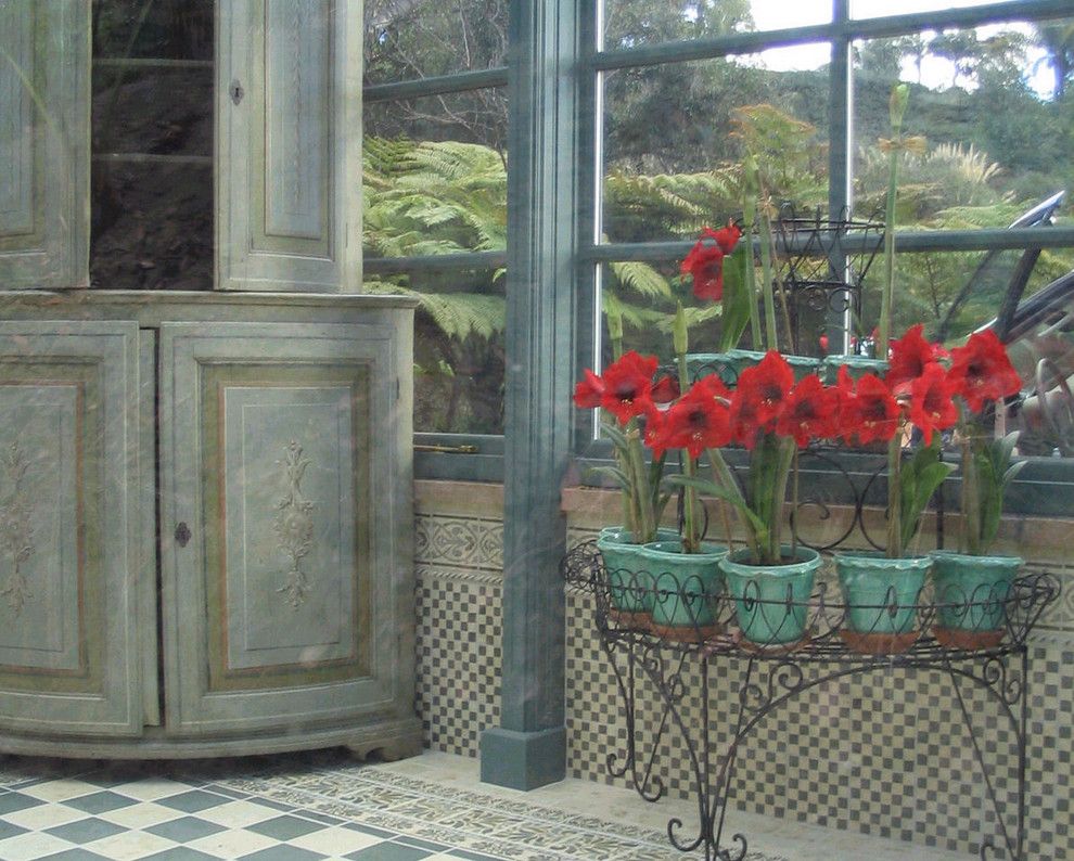 Betenbough Homes for a Eclectic Porch with a Spanish Floor and Sunroom by Filmore Clark