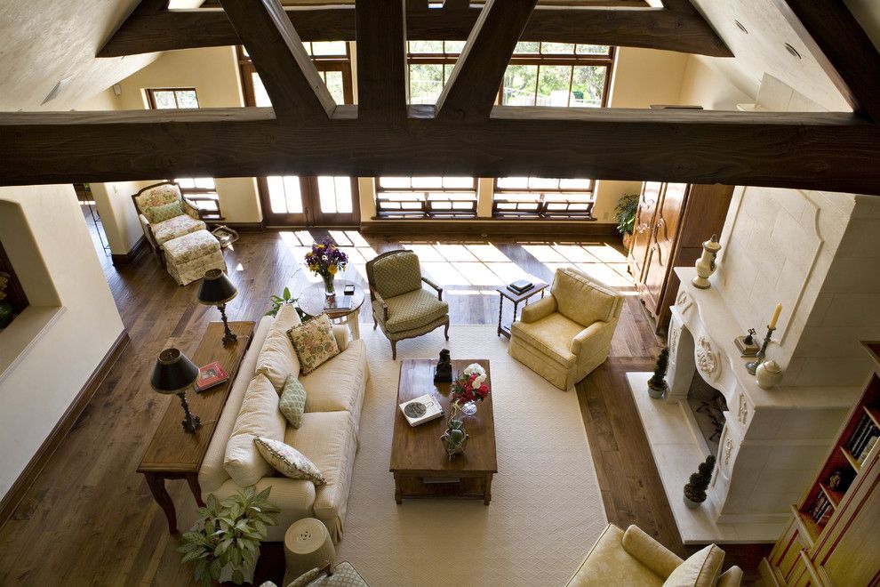 Bif Furniture for a Traditional Family Room with a Exposed Beams and Living Room by Claudio Ortiz Design Group, Inc.