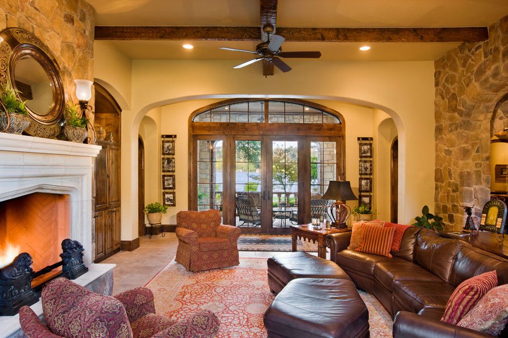 Binswanger Glass Austin for a Traditional Family Room with a Stone Wall and Lake Austin by Geschke Group Architecture