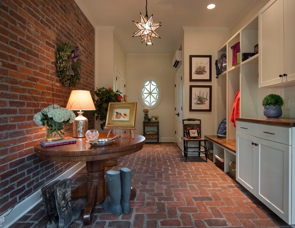 Brick Wall Waterfall for a Farmhouse Entry with a Built in Cabinets and the Elizabeth Project by Kbc   Kelley Building Company