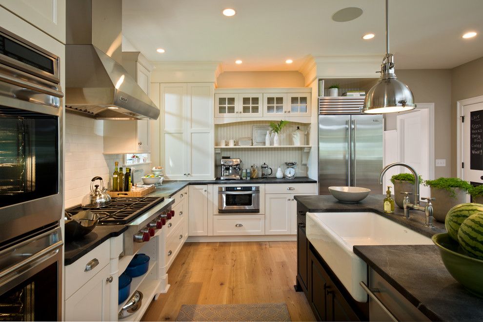 Brick Wall Waterfall for a Traditional Kitchen with a Black Countertop and 2013 Parade of Homes   Pinnacle Homes Winner   Best Kitchen by Columbia Cabinets