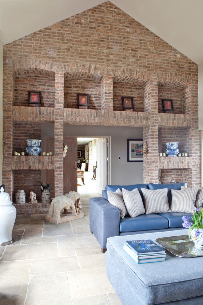 Brick Wall Waterfall for a Transitional Living Room with a Stone Elephants and the Grange by Carolyn Parker Interior Design Ltd.