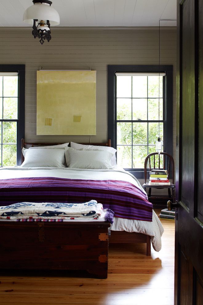 Broken Arrow Theater for a Farmhouse Bedroom with a Purple Blanket and Country Living 2012 by Tim Cuppett Architects