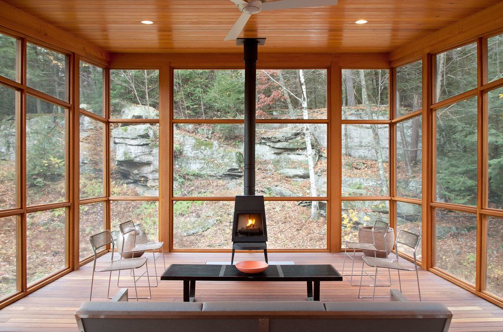 Buckeye Heating and Cooling for a Rustic Sunroom with a Wood Porch and Bug Acres of Woodstock by Cwb Architects