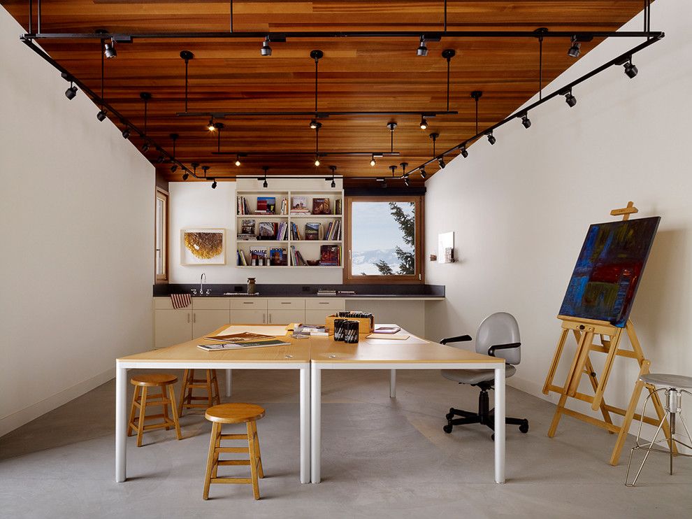 Burke Flooring for a Contemporary Home Office with a Canvas Painting and Butte Residence by Carney Logan Burke Architects