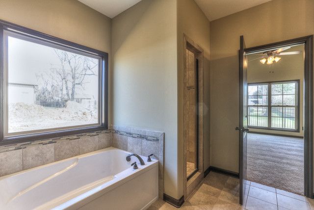 Buster Crabbe Pools for a Contemporary Bathroom with a Clarksville and All Brick Ranch Home in Gated Community by Crabbe Homes