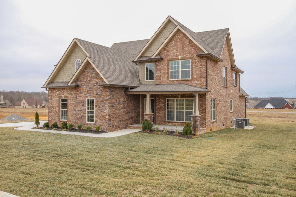 Buster Crabbe Pools for a Traditional Exterior with a Covered Porch and Custom Home in Stones Manor by Crabbe Homes