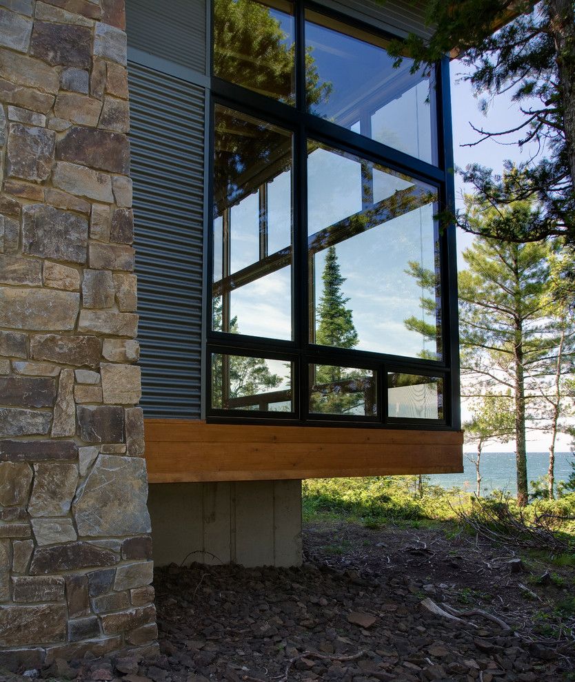 Castle Metals for a Modern Exterior with a Lakefront and Eagle Harbor Cabin by Finne Architects