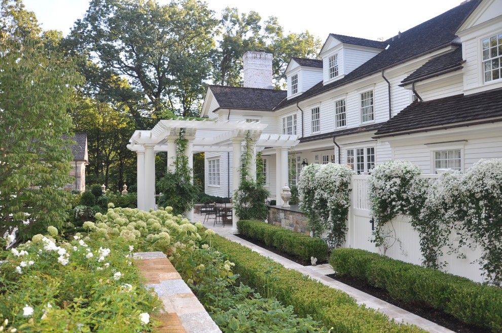 Cat5e vs Cat6 for a Traditional Landscape with a Stone Walkway and a Classic Country White Garden by Deborah Cerbone Associates, Inc.