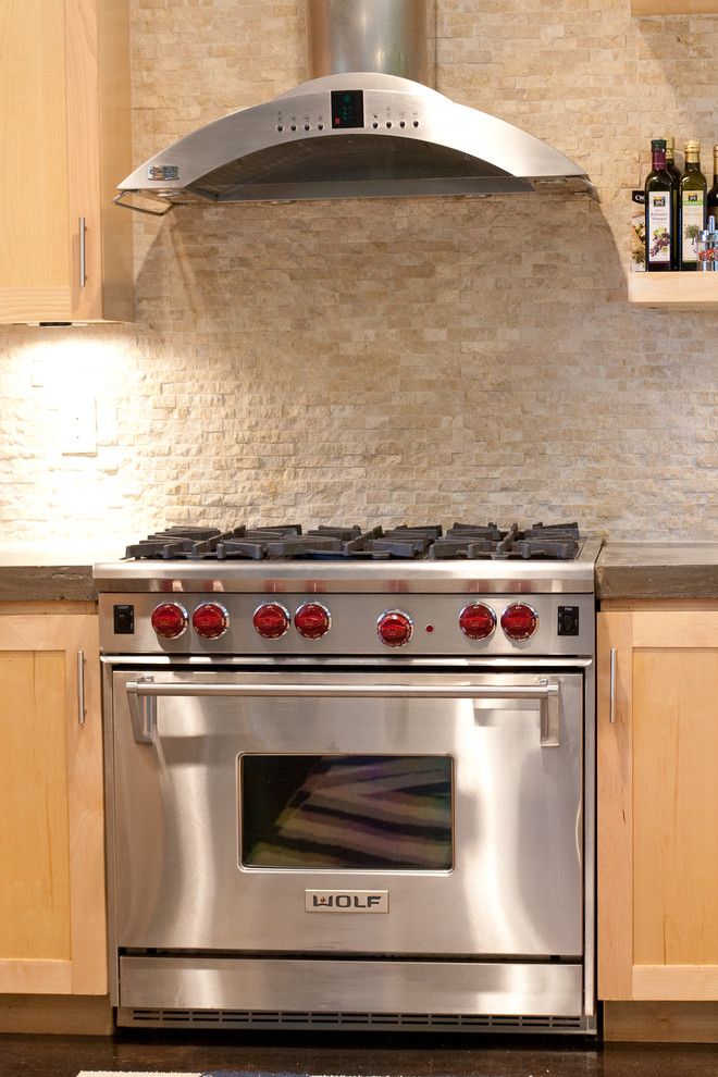 Ceco Concrete Construction for a Modern Kitchen with a Stainless Steel Range and Vanderbilt by Modern Craft Construction, Llc