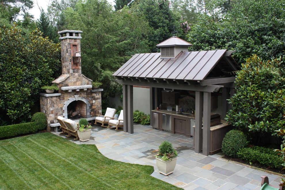 Charleston Sc Points of Interest for a Traditional Patio with a Container Plants and Outdoor Kitchen and Fireplace by the Collins Group/jdp Design