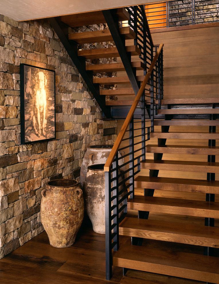 Chesapeake Landing for a Rustic Staircase with a Wood Bannister and Wilson Mountain Residence by Poss Architecture + Planning and Interior Design