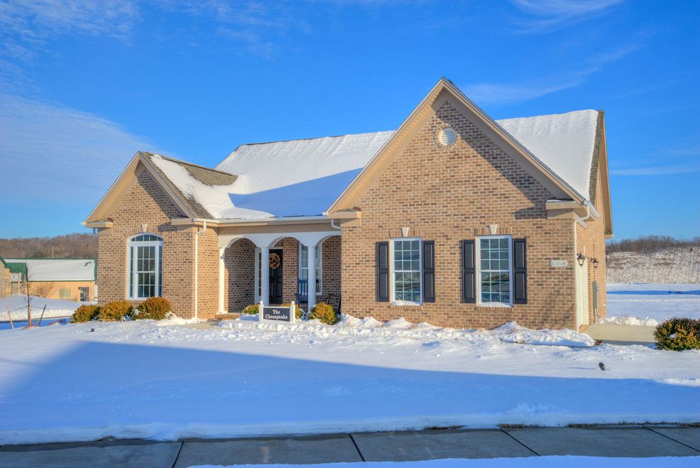 Chesapeake Landing for a Transitional Spaces with a Brick Exterior and the Chesapeake Model at Heron's Landing by Stateson Homes