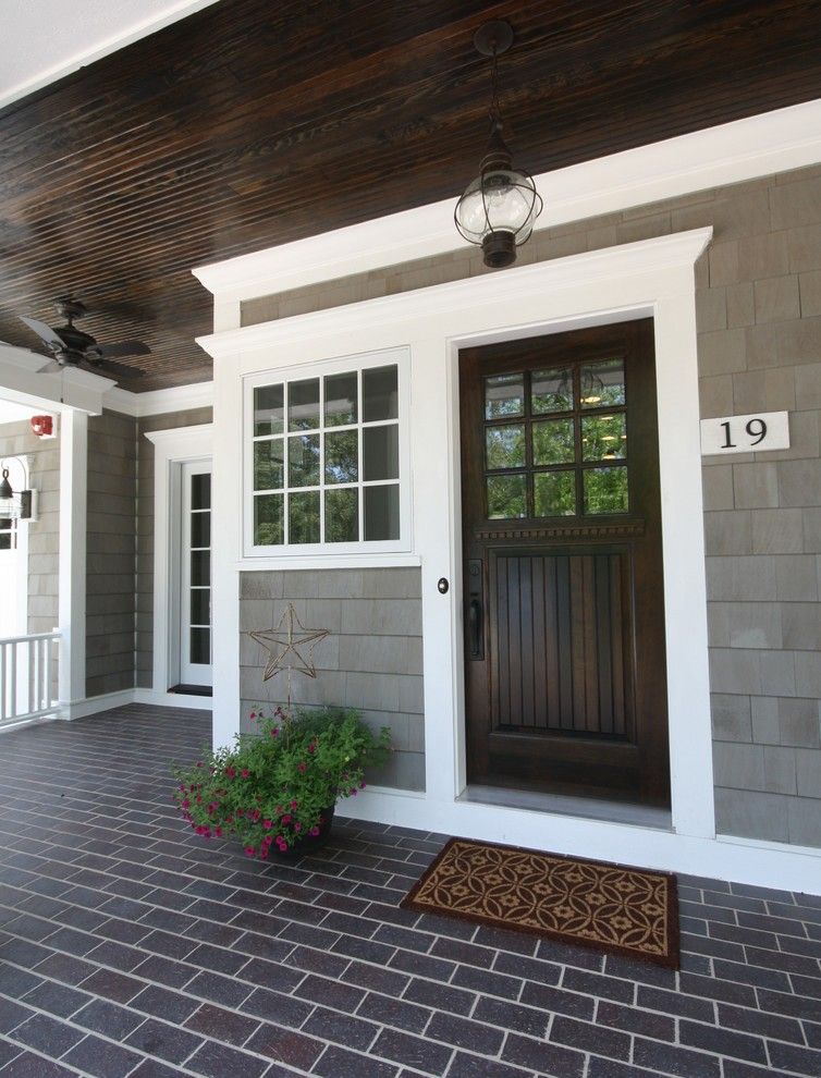 Chi Overhead Doors for a Beach Style Entry with a Pendant Light and Matthies Builders by Matthies Builders