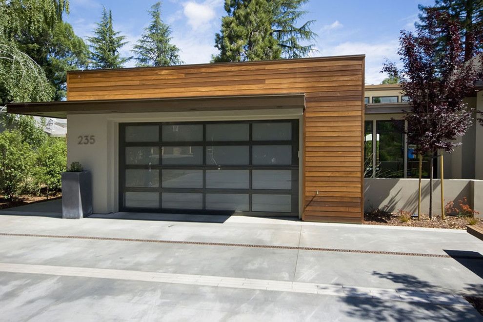 Chi Overhead Doors for a Contemporary Garage with a Garage Door and Home Front Yards by Mark Pinkerton    Vi360 Photography