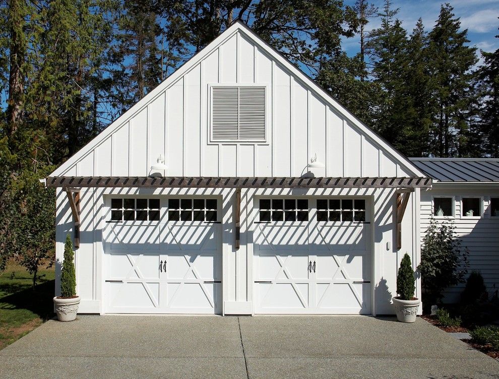 Chi Overhead Doors for a Eclectic Garage with a Pergola and Garage by Dan Nelson, Designs Northwest Architects