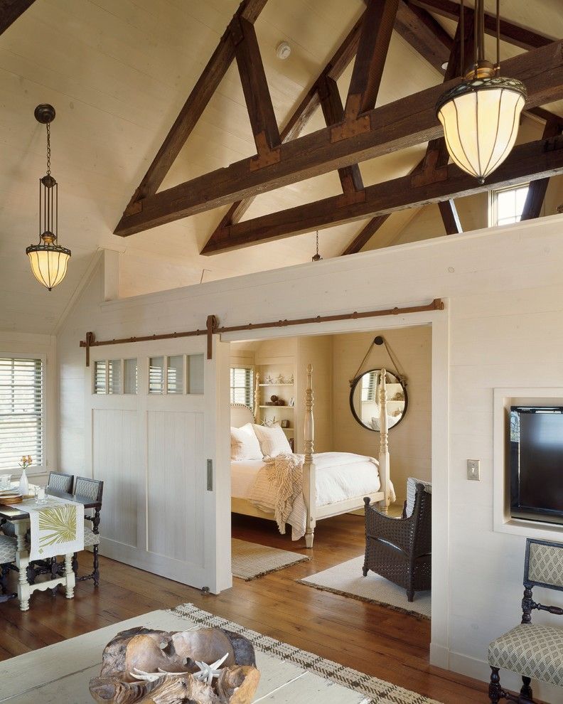 Chi Overhead Doors for a Farmhouse Bedroom with a Barn Door and West Falmouth Residence by C.h. Newton Builders, Inc