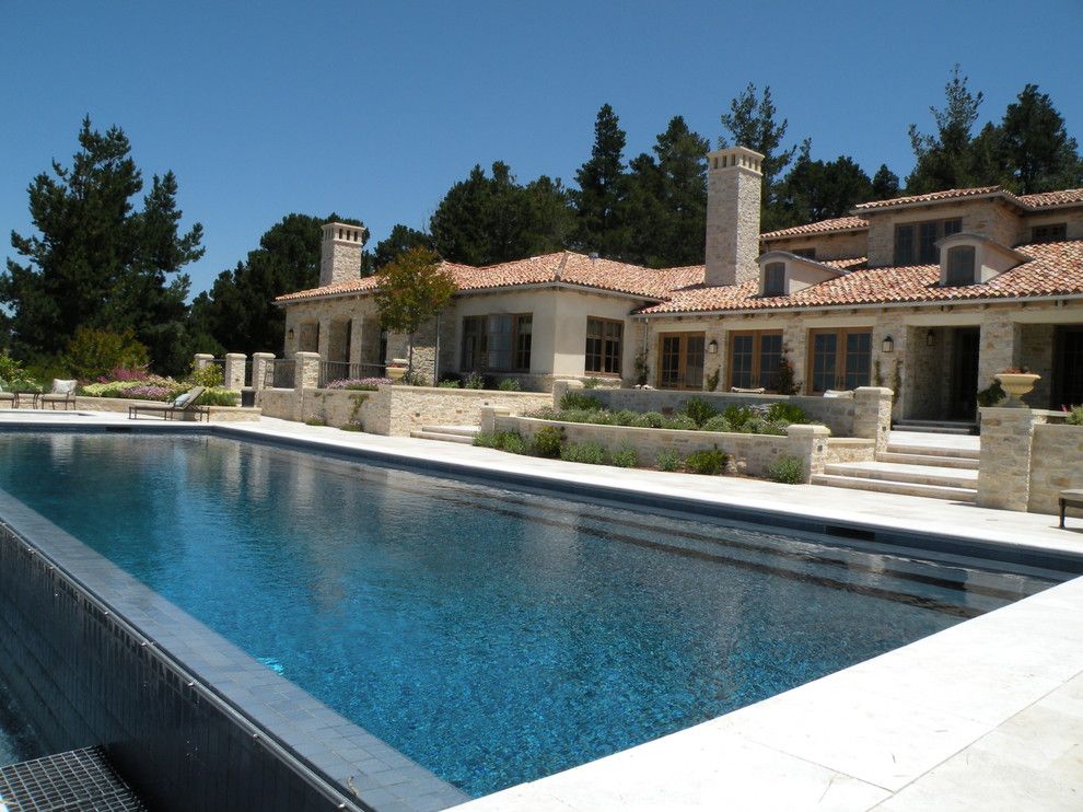 Chim Chimney for a Mediterranean Pool with a Infinity Pool and Carmel Mountain Retreat 01 (Design by Suzman Cole Design Associates) by Frank & Grossman Landscape Contractors, Inc.