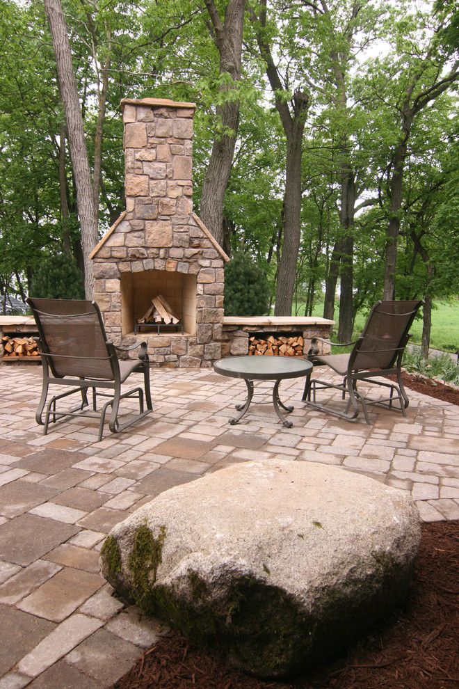 Chim Chimney for a Rustic Patio with a Firewood Storage and Mn Luxury Home Tour by Yardscapes Inc.