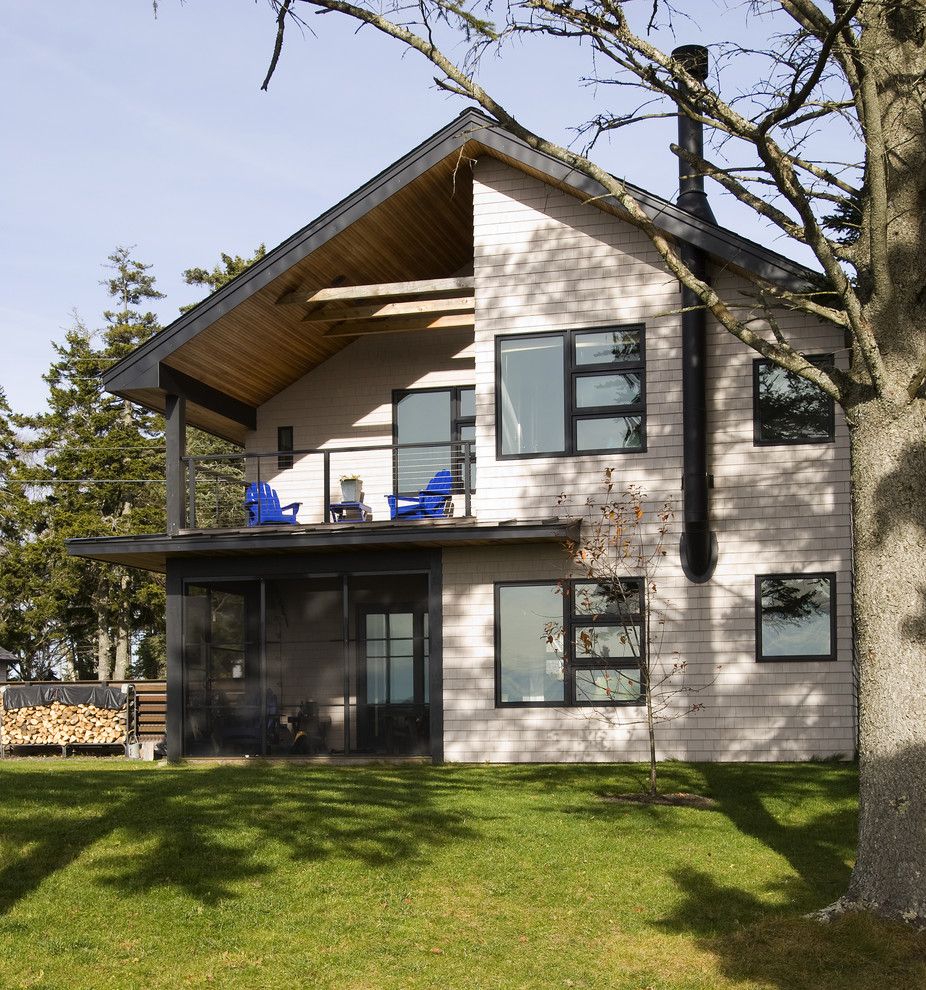 Chiminey for a Rustic Exterior with a Lawn and Exterior by Larson Shores Architects