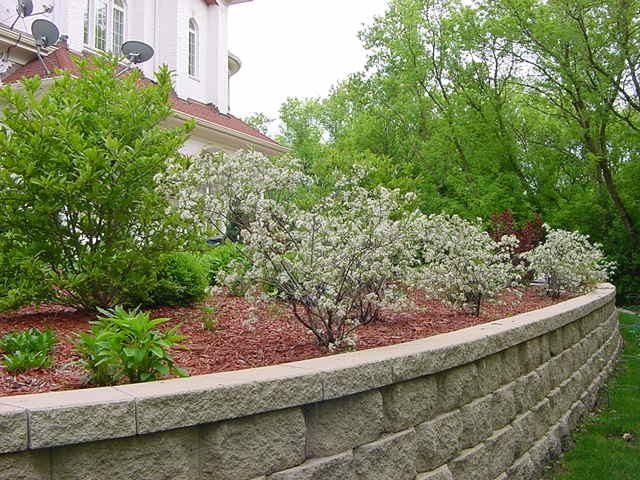 Cinder Block Retaining Wall for a Modern Landscape with a Water Fountain and Spring & Fall Landscaping Add Color to Your Landscaping, Gardens & Outdoors by Jagannath & Manjula Juluri, Landscape Architects